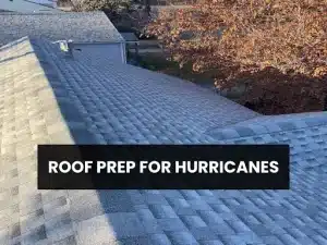 A sloped roof covered with shingles, featuring text overlay that reads “Roof Prep for Hurricanes” against a backdrop of trees.