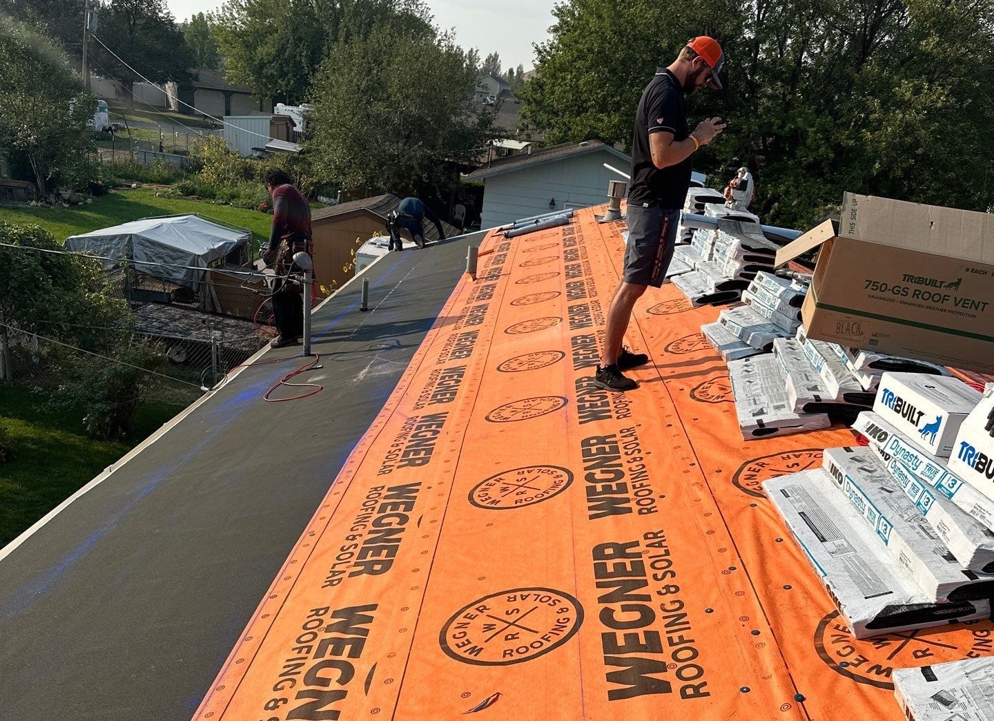 A Spearfish Roofing Contractor team by Wegner Roofing & Solar prepping a residential roof with high-quality materials.